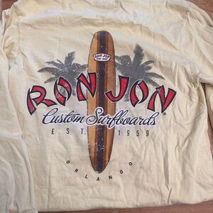 Ron Jon Pale Yellow Long Sleeve Surfboard Graphic Tee with Red Logo